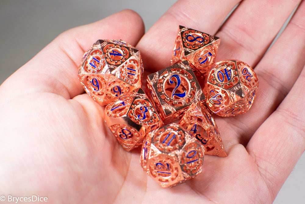 Rose Gold Metal Hollow Gear Dice with Blue Numbers 7-Dice Set -