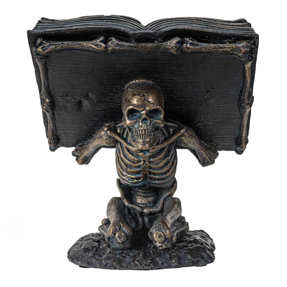 Skeleton holding Spell Book -