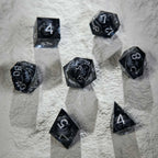 Dark Sorcerer's Skull Frame Liquid Core Resin Dice Set Silver Font